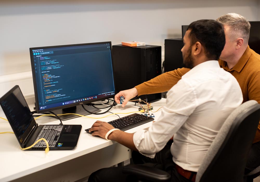 Computer Science student working at computer